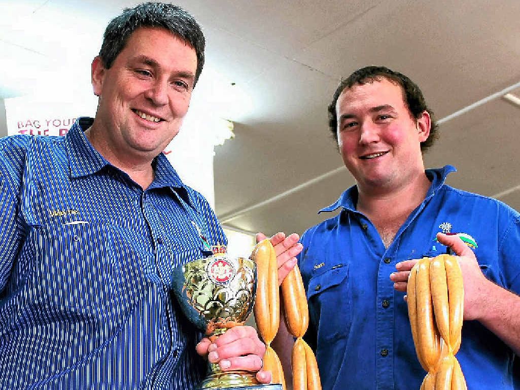 SAUSAGE KINGS: Carey Bros butchers Wayne Carey and Sam Dight are celebrating their recent win at the Outback Sausage King titles with their butter chicken sausages.